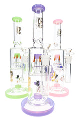 Assorted bee glass bongs with green, purple, and pink accents, straight tubes, and clear bowls