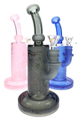Assorted frosted floral glass bongs in pink, gray, and blue with bent necks and clear bowls