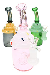 Assorted cupcake glass bongs in pink, green, and gray with sprinkle accents and clear bowls