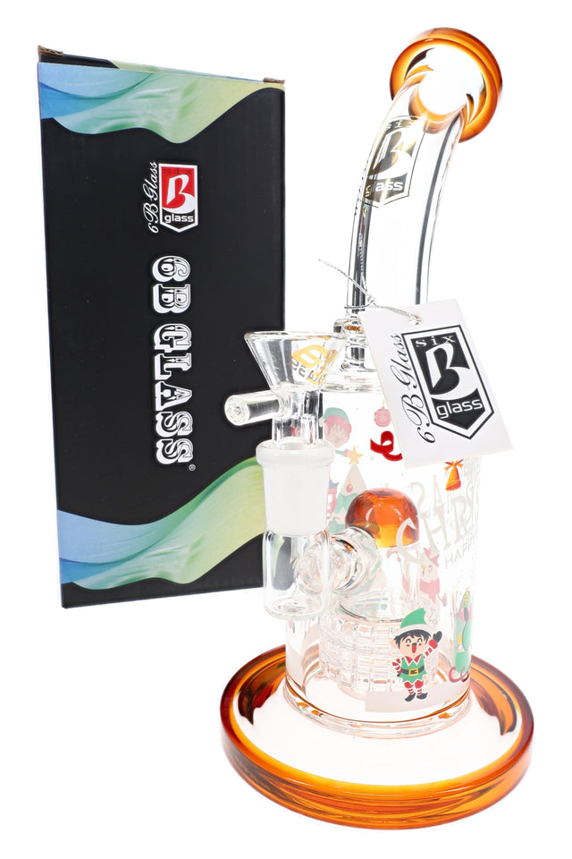 Amber 6B Glass Christmas bong beside retail box showing dome matrix perc, Santa artwork, and clear bowl