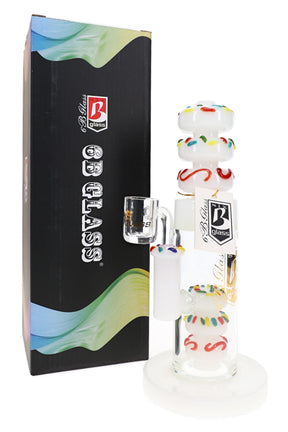 White 6B Glass donut stack dab rig with sprinkle percs, clear bucket accessory, and retail box