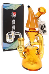 Amber 6B Glass banana recycler dab rig with showerhead perc, clear bucket accessory, and retail box
