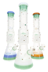Assorted 6B Glass space beaker bongs with frosted planet graphics, tree percs, and colored trim
