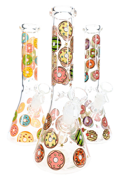 Assorted donut decal glass beaker bongs with bright sprinkled designs and clear glass bowls
