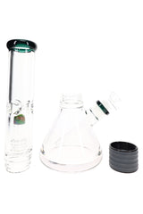 Disassembled two-part glass beaker bong showing upper tube, beaker base, bowl, and black sleeve