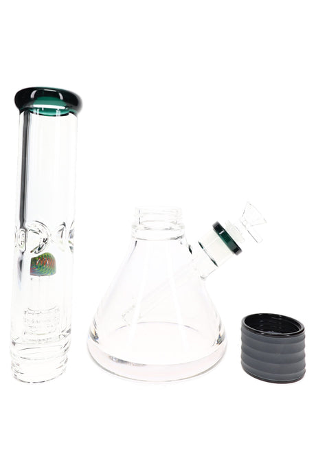 Disassembled two-part glass beaker bong showing upper tube, beaker base, bowl, and black sleeve