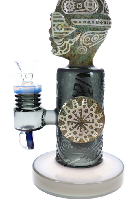 Close-up of frosted glass bong body with etched gear pattern and stone-style side accent