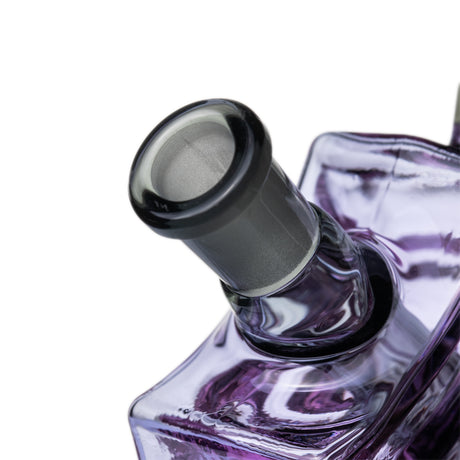 Close-up of MJ Arsenal Nightcrawler dab rig 10 mm female joint with frosted glass connection above purple web body