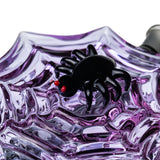 Close-up of black spider accent with red eyes attached to the purple spiderweb body of MJ Arsenal Nightcrawler dab rig