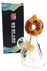 Orange 6B Glass donut beaker bong with raised multicolor sprinkles, clear bowl, flared base, and retail box