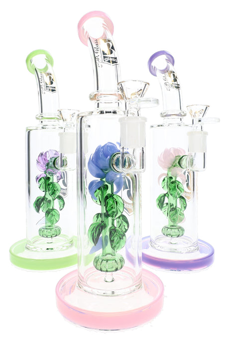 Three 6B Glass rose perc bongs with green leafy stems and pink, green and purple accents.