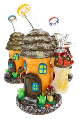 Three 6B Glass mushroom hut bongs with orange cottage bodies, layered brown roofs and colorful mouthpiece rims.