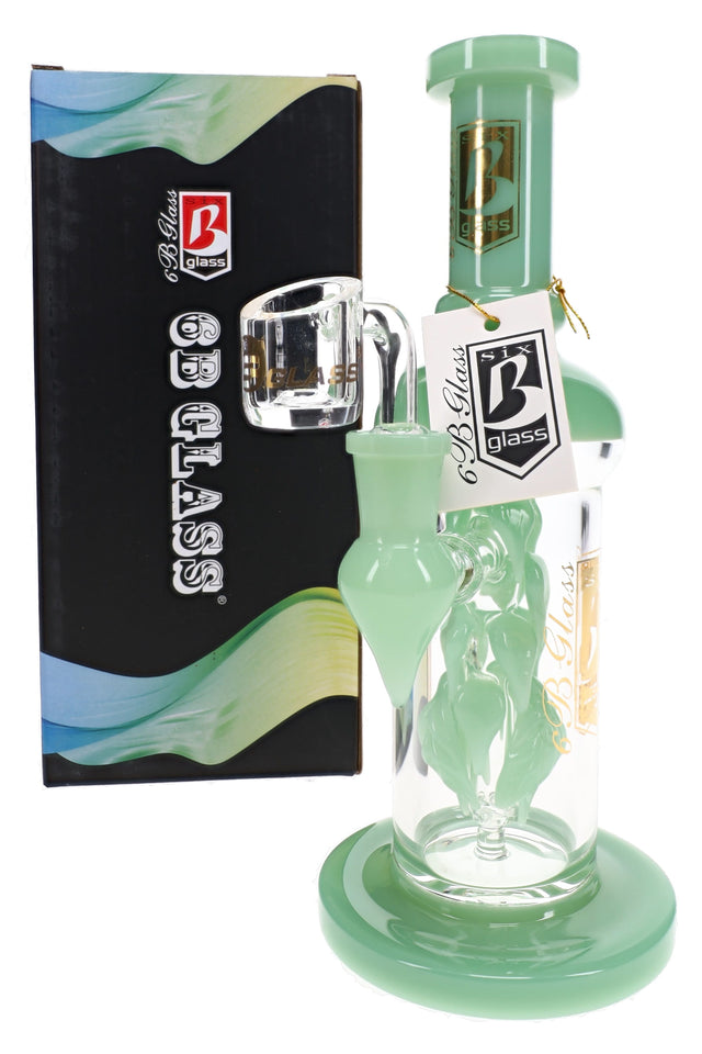 Mint-accented 6B Glass vine leaf dab rig with a clear banger and leaf-shaped side detail beside its branded box.