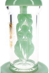 Close-up of sculpted mint-green glass leaves winding around the internal perc inside a clear 6B Glass dab rig.