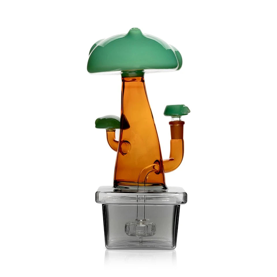 Rear view of Hemper Bonsai XL glass bong with an amber trunk, green canopy and showerhead perc in a dark planter base