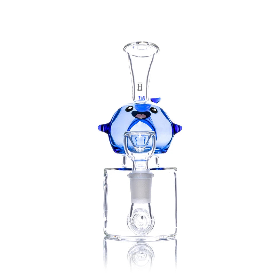 Front view of Hemper Blue Whale bong showing its smiling face, blue fins, clear mouthpiece and glass bowl