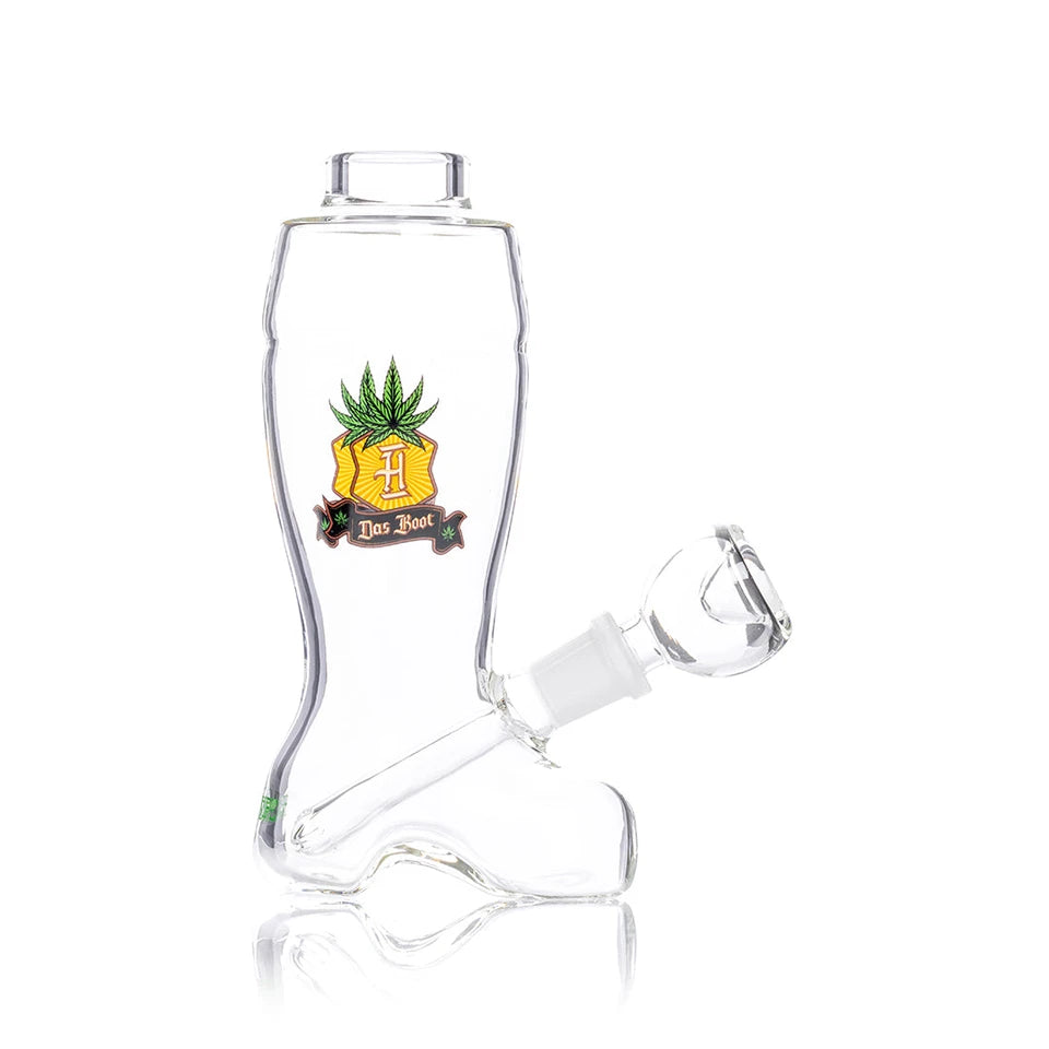 Side view of Hemper Das Boot bong showing its boot shape, gold-and-green crest and angled clear glass bowl