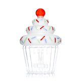 Side view of Hemper Cupcake XL bong showing its red cherry topper, white frosting and clear scalloped base