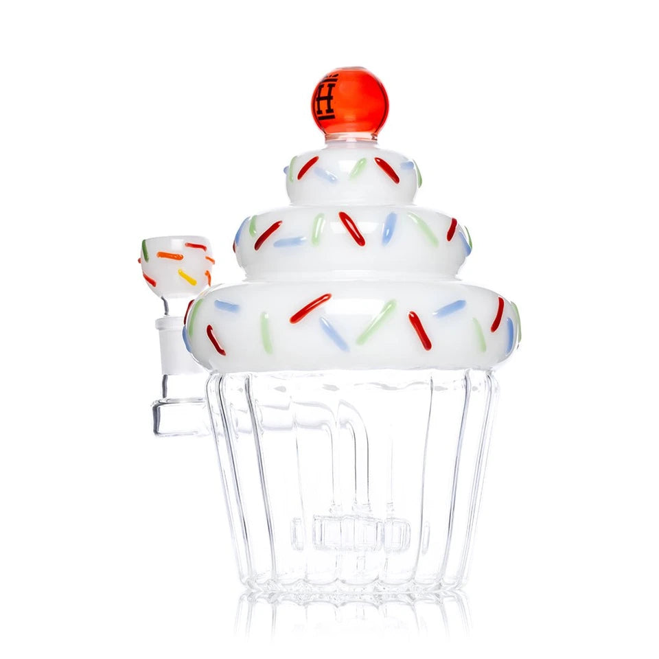 Three-quarter view of Hemper Cupcake XL bong showing raised colorful sprinkles and a cupcake-wrapper base