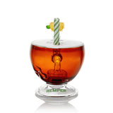 Rear view of Hemper Pina Colada XL glass bong showing its striped mouthpiece and green logo on the clear base