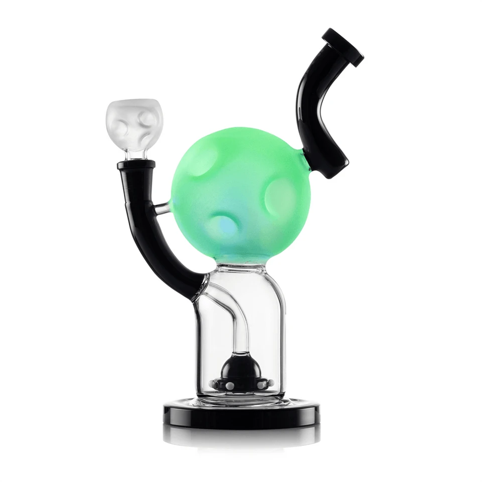 Hemper Moon XL bong showing its moon chamber glowing green above a clear base with a black UFO-shaped perc