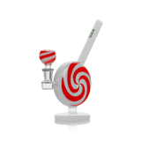 Angled view of Hemper Jollypop glass bong with a red spiral design, matching bowl and white pedestal base