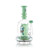 Angled view of green Hemper Space Monster XL bong with a matching bowl, clear dome and saucer-shaped base