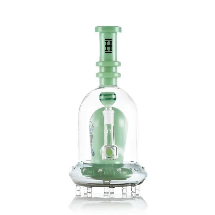 Bowl-end view of green Hemper Space Monster XL glass bong with a matching neck and clear feet beneath the base