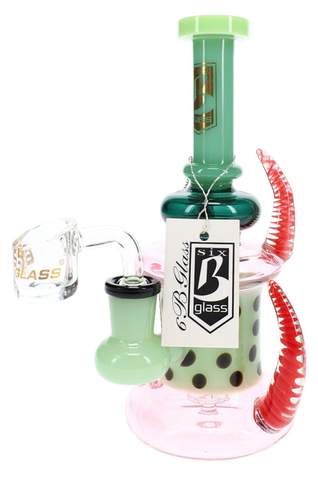 Alternate view of 6B Glass spiked dab rig with neon-green accents, dotted chamber, clear banger, and brand tag.