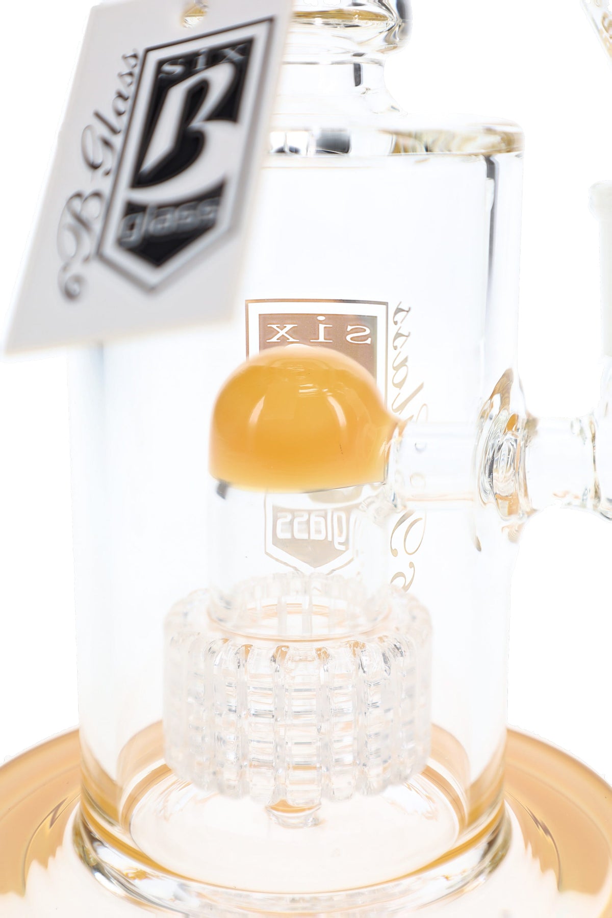 Close-up of clear matrix percolator beneath a yellow dome inside a 6B Glass bong with a yellow-accented base.