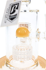 Close-up of clear matrix percolator beneath a yellow dome inside a 6B Glass bong with a yellow-accented base.