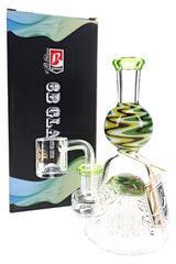 6B Glass reverse tree perc dab rig with multicolor zigzag accents, green mouthpiece, clear banger, and branded box.