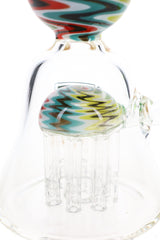 Close-up of reverse tree percolator with clear glass arms beneath a multicolor zigzag-patterned dome.