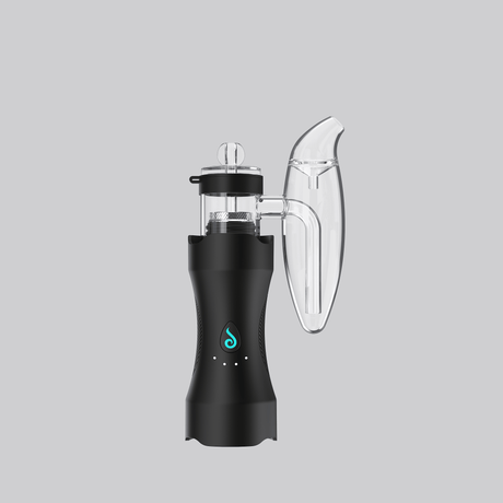Portable Dr. Dabber XS dab rig in black with clear bubbler, teal logo accent, and compact travel-ready profile