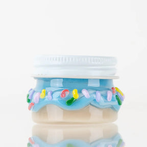 1.5-inch blue donut-style glass terp jar with rainbow sprinkle accents, straight side profile on white background