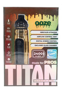 Gold Ooze Titan retail package with device insert, showing flex temp, 2400 mAh power, and enclosed glass chamber for concentrates.