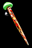 Single green-cap striped mushroom glass dab tool with red, yellow, and white spiral stem, angled on black surface.
