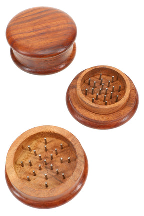 Round 2-part wood herb grinder with metal pin teeth, 2¼″ (56 mm) diameter, smooth domed lid shown open and closed.