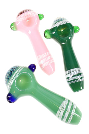 4.5″ slime-colored glass hand pipe with white wrap stripes, silver-fumed floral bowl, side carb, and marble grips in assorted colors.