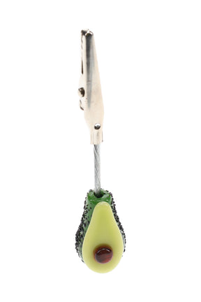 US-made Empire Glassworks avocado roach clip with metal alligator clamp, textured green glass and brown pit on a flexible cable.