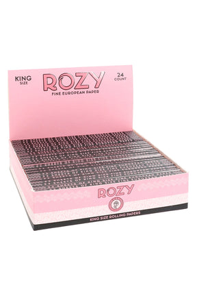 ROZY pink king size rolling papers 24-count display tray with stacked booklets, labeled fine European paper, retail-ready.