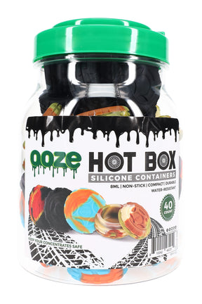 Large jar holding 40 Ooze Hot Box 8-ml silicone concentrate containers with green lid and branded label, ideal bulk pack for personal dab storage