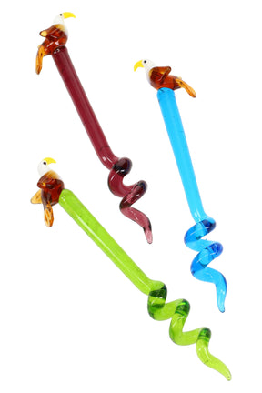 Trio of 6-inch glass dab tools with perched eagle toppers and red, blue, green twisted stems, photographed on white background to highlight colors and spiral design.
