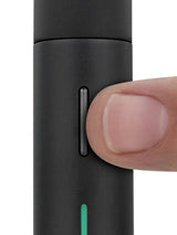Close-up of the Puffco Pivot’s elongated side button being pressed, showing tactile control placement on the vaporizer body.