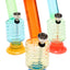 Trio of ribbed 6-inch acrylic bongs in assorted colors with wide suction bases and metal bowls, lightweight and portable.