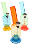 Trio of ribbed 6-inch acrylic bongs in assorted colors with wide suction bases and metal bowls, lightweight and portable.
