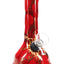 Red marbled 6″ ceramic beaker bong with gold sunburst design and compact form suited for quick sessions.