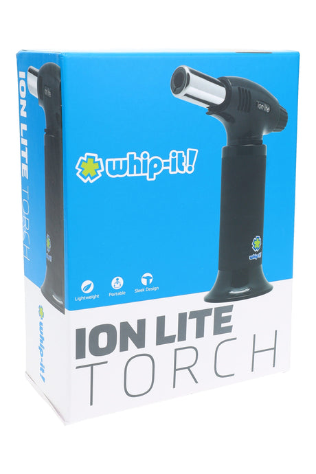 Whip-It Ion Lite torch in black on packaging, portable dab torch with metal burner tip, angled right side.