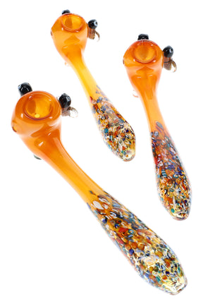 Gold fumed glass sherlock pipes with confetti frit and bee accents shown in assorted group product view