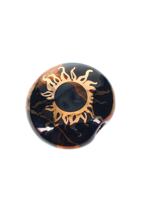 2-inch round black ceramic smoke stone hand pipe with metallic gold sun and marbled accents.